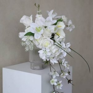 Bridal artificial cascade bouquet adorned with white rose