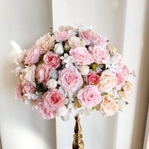 Wedding table centerpiece with artificial flowers in a romantic style