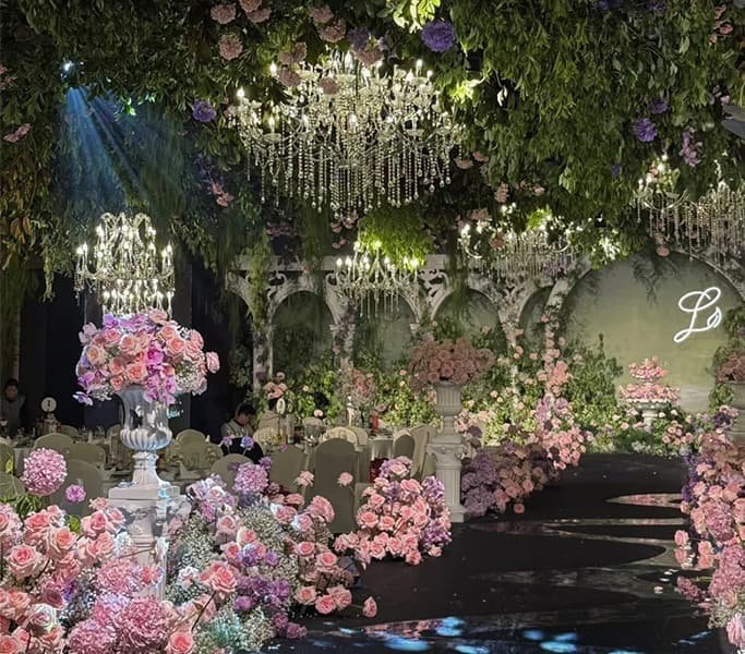 Artificial Flowers for Wedding 11 Grand wedding banquet hall featuring opulent artificial floral decorations and crystal chandeliers for luxury events